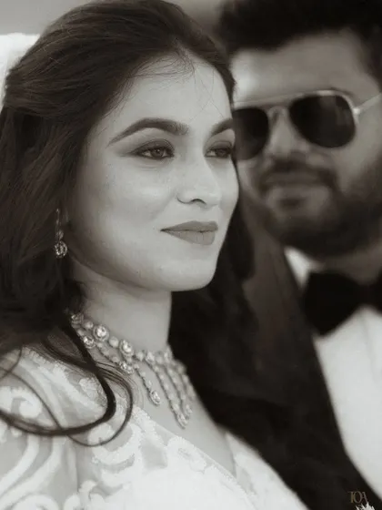 A classic black and white portrait of the couple.