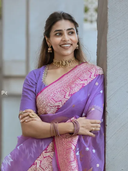 Our client looking effortlessly chic and happy in her custom purple saree ensemble.
