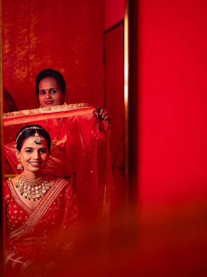 A touching moment between a mother and daughter, reflected in a mirror as the bride gets ready. We capture these precious family interactions.