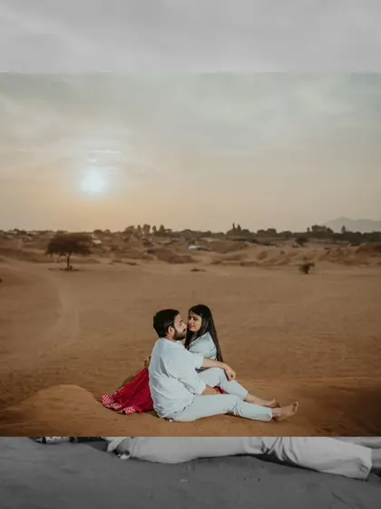 A beautiful sunset shot in the Pushkar desert. The warm golden light and serene landscape create a perfectly romantic setting for this intimate couple portrait.
