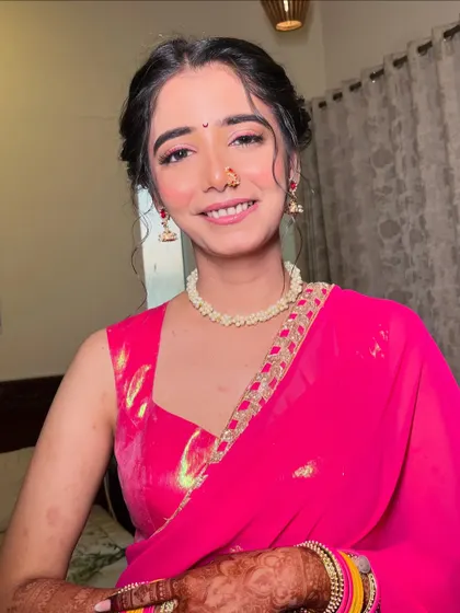 A final look at this stunning Haldi makeup. The bright pink saree and fresh makeup are a perfect combination for this joyous occasion.