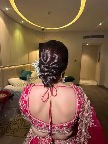 Another angle of the woven messy bun, highlighting the clean lines and texture. This style is perfect for a bride who wants a modern yet elegant look for her wedding day.