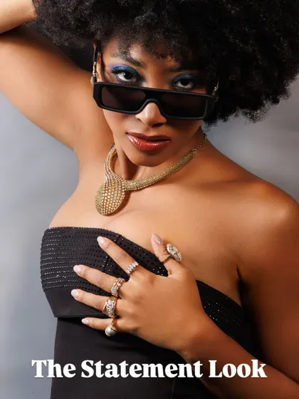 This is what we call a statement look. The combination of bold sunglasses, a textured gold necklace, and confident posing creates an image that is all about attitude. We direct every element to ensure the brand's story is told with power.