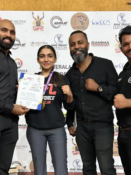 Our female fighter with her medal at the Kerala Nationals. She fought with skill and courage.