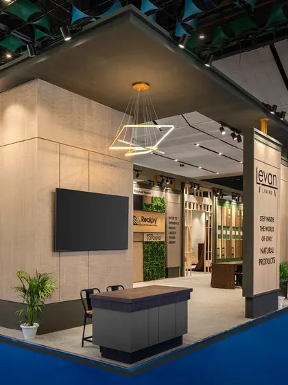 This corner view of the Realply stall shows the powerful composition of solid masses and open entryways. The design uses a simple yet bold geometric language to define the 240 sq.m space.