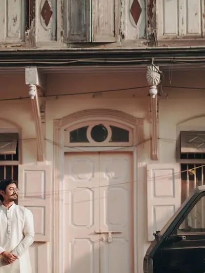 A classic pose in front of a charming old building. This shot has a timeless, storybook quality.