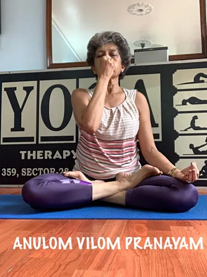 I am demonstrating Anulom Vilom Pranayam, a key breathing technique we practice. This alternate nostril breathing is excellent for calming an anxious mind, balancing your energy, and improving sleep during pregnancy.