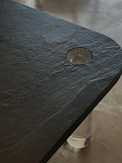A close-up on the textured slate stone veneer used for our "Dark Romance" coffee table. The natural grains and layers of the stone create a striking and unique surface.