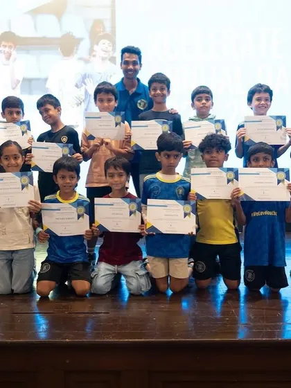 The U9 Xcelerate team proudly displaying their certificates of achievement.
