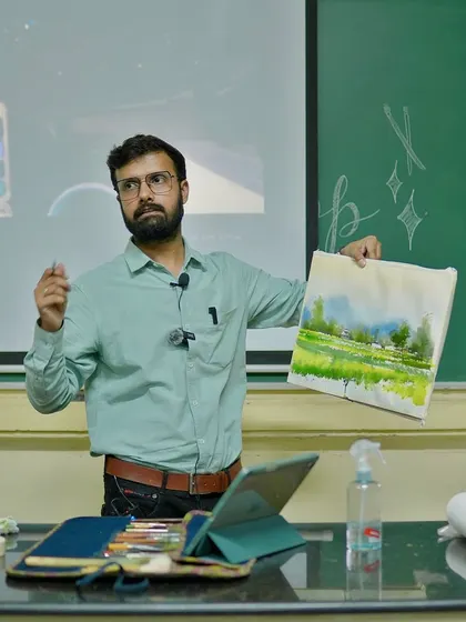 Presenting the completed landscape painting to the students at IIT BHU, explaining the key elements and techniques used.