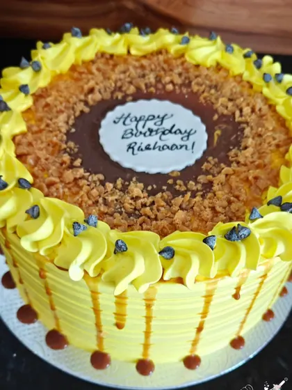 A detailed shot of the butterscotch drip and crunchy praline on my popular butterscotch cake.