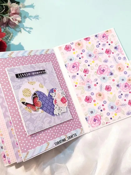 Inside a friendship scrapbook, this page uses soft pastel and floral patterns to create a gentle, pretty backdrop for cherished photos.