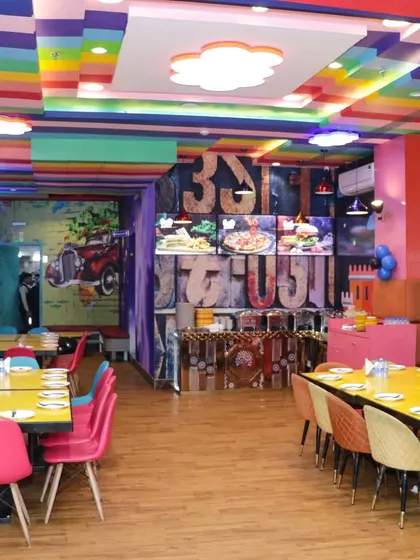This is where the party happens! Our colorful and vibrant cafe area is perfect for cake cutting, enjoying a delicious buffet, and giving guests a comfortable space to relax between play sessions.