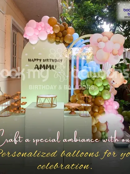 We craft a special ambiance with personalized balloons. This elegant outdoor setup for Ammu's birthday features a modern arch backdrop and a sophisticated balloon garland in pastel and earth tones.