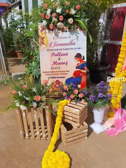A personalized welcome sign for a Seemantha function. I decorated the entrance area with rustic wooden crates, floral arrangements, and marigold garlands.