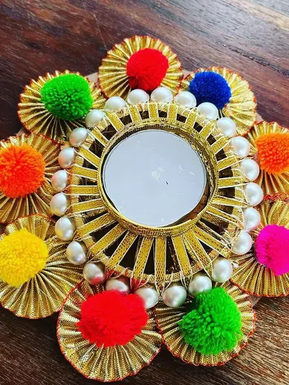 This top-down view really shows off the vibrant colors and symmetrical design of our handmade tea light holder. It’s a small piece that makes a big impact.