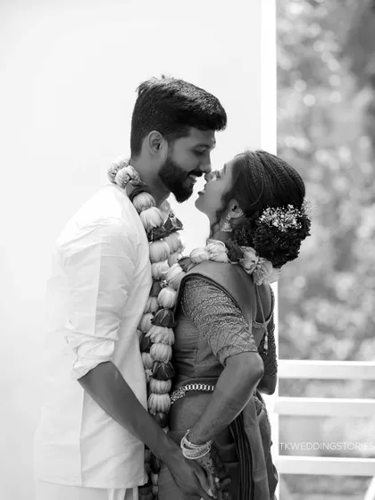 A beautiful black and white portrait of a Kerala couple sharing a loving gaze after their wedding. The monochrome tones add a timeless, classic feel.