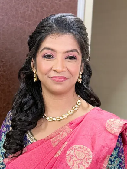 A beautiful portrait showing the soft and elegant makeup. The look is perfect for a family member attending a wedding, providing a polished and festive feel.