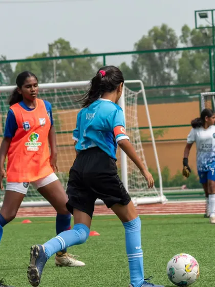 Our girls in action during a practice match, learning to work together and compete effectively.