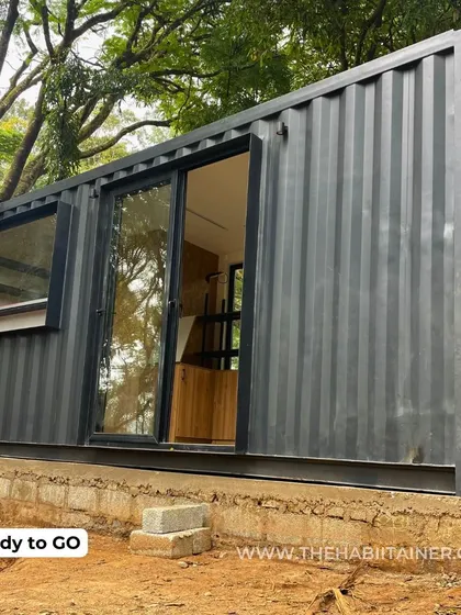 The TATA COFFEE container store is successfully placed on its foundation, ready for the final connections. The unit is delivered with windows and doors pre-installed, dramatically speeding up the setup time.