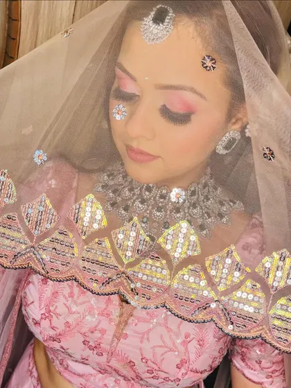 A creative shot with sequins on the face, adding a touch of modern artistry to the bridal look.