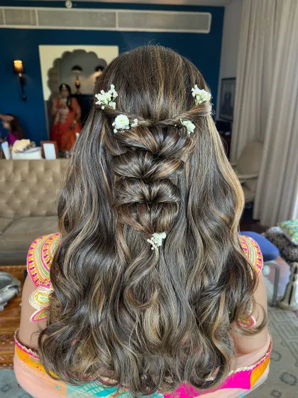 A perfect example of a romantic and complex half-up style that is still soft and wearable.