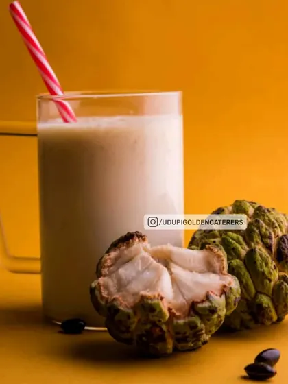 A thick and creamy Custard Apple (Sitaphal) Milkshake, made with seasonal fruit. This unique and delicious shake is a special treat on our menu.