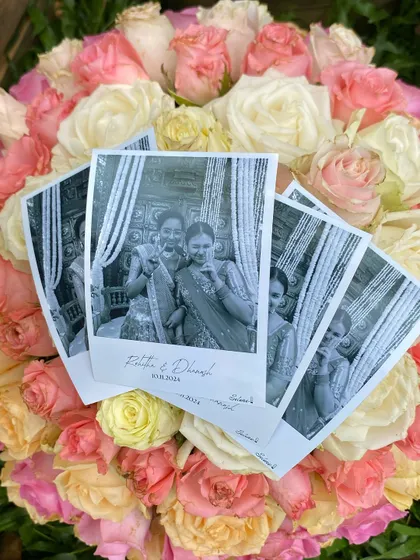 A creative shot of the wedding photo prints nestled in a bouquet of roses. My prints are high-quality keepsakes, beautiful enough to be part of your wedding decor.