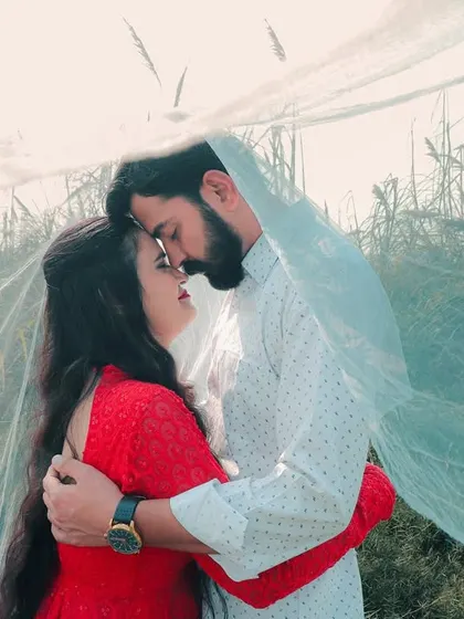 Using a sheer veil to create a dreamy and intimate pre-wedding portrait. This technique adds a touch of romance and artistry to the shot.