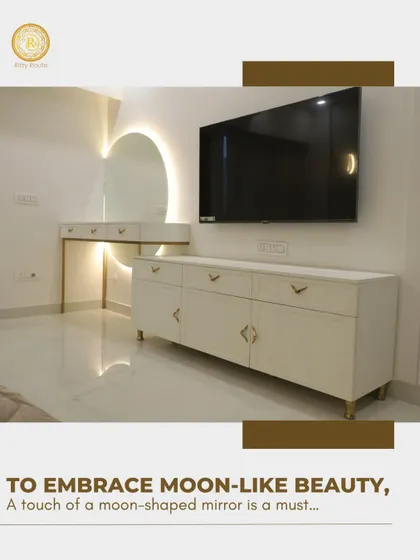 Another look at the moon-shaped mirror, this time integrated into a full bedroom unit with a TV console and vanity, creating a cohesive and beautiful feature wall.