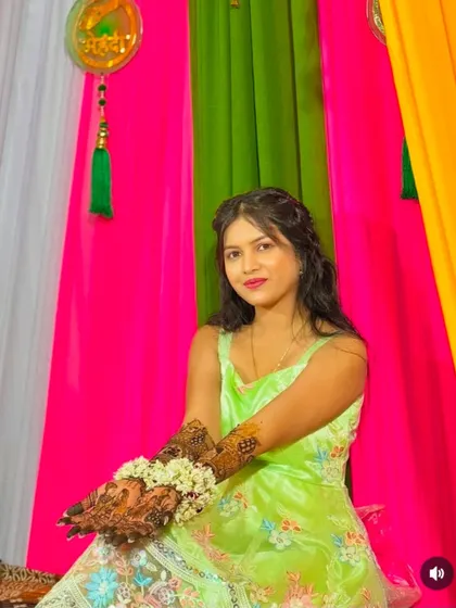A lovely portrait of a bride proudly displaying her full bridal mehndi.