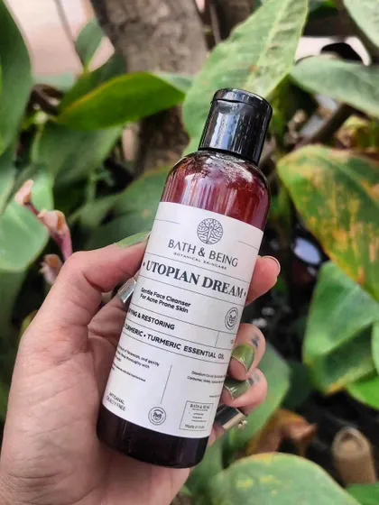 A bottle of our Utopian Dream facewash, a customer favourite for its ability to tackle acne-prone skin gently. It's made with wild turmeric and nourishing amino acids.