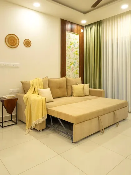 Here, the sofa-cum-bed is pulled out, demonstrating its functionality. This is a key feature for clients who need their spaces to be flexible and multi-purpose.