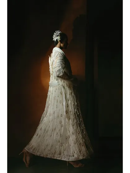 A full-length profile shot showing a model in motion. Capturing movement is key to bringing life and energy to a fashion campaign, making the clothes feel dynamic.