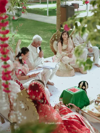 A serene moment during the wedding ceremony, with family members participating in the rituals.