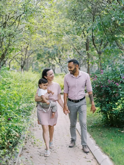A family stroll through the park. The time before a baby starts walking is perfect for these cuddly, connected shots.
