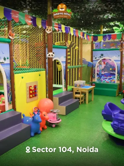 Here is a wide view of our jungle-themed indoor playground. I wanted to create a vibrant, clean, and safe space packed with different activities, from the foam pit to the trampoline and merry-go-round.