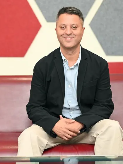 A corporate portrait using the office's modern interior design as a backdrop. This helps to communicate the company's brand identity along with the leader's personality.