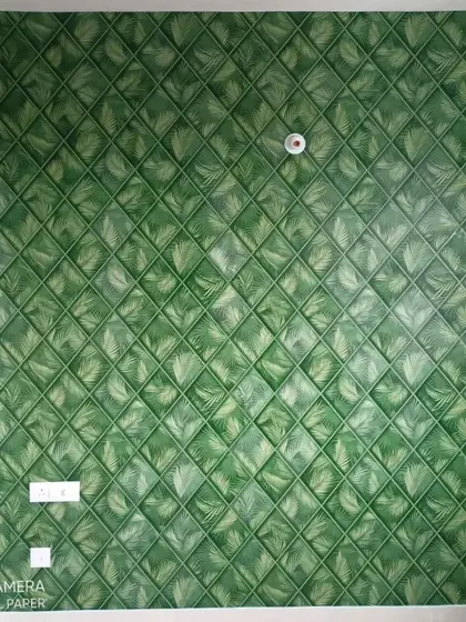 A unique 3D wallpaper with a quilted pattern of green leaves. This design is highly textured and creates a lush, botanical feel with a modern geometric twist.