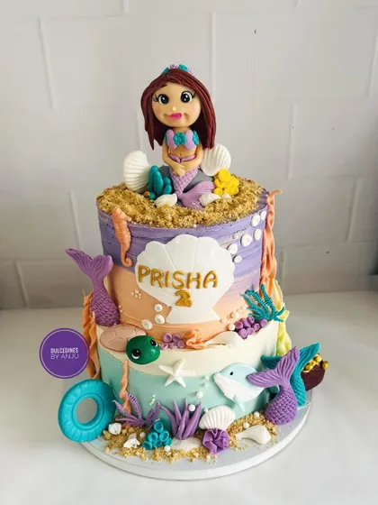 The same stunning mermaid cake, shown here without the clear globe, highlighting the detailed two-tier design.