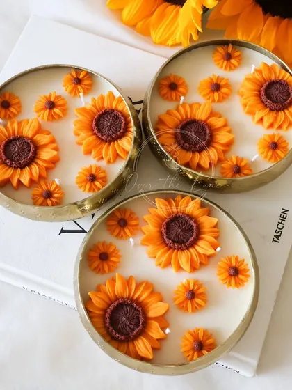 Another look at the Sunflower Urli candles, showcasing their detailed craftsmanship. Each sunflower is individually crafted before being placed in the urli.
