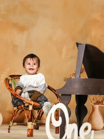 A rustic, boho-themed first birthday shoot. The neutral tones and natural textures create a warm and timeless look.