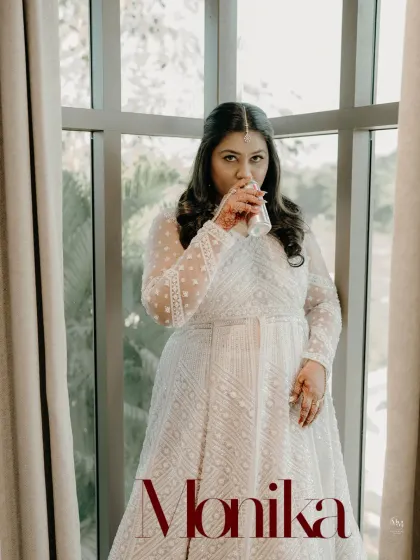 A stylish portrait of the bride-to-be, Monika, enjoying a quiet moment before her engagement ceremony. The graphic overlay adds a modern, editorial touch.