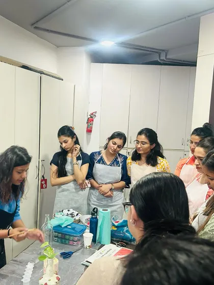 I love guiding teams through new creative processes. Here, I am demonstrating a decoupage technique for a corporate craft workshop.
