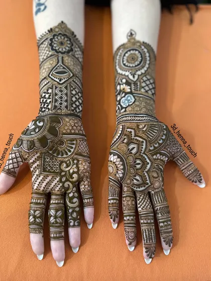 A full bridal design with different patterns on each hand. This showcases our ability to create two unique yet cohesive looks for a bride's special day.