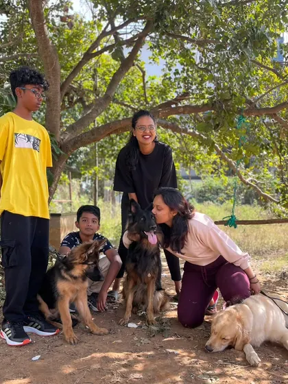 A happy group photo after a successful session. It's wonderful to see kids and dogs learning together, creating a well-socialized pack.