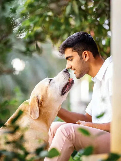 A nose-to-nose moment of pure affection between a young man and his senior Labrador. These are the priceless connections that I am so passionate about capturing for families to cherish forever.