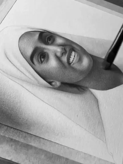 Using a soft brush to blend the graphite for the skin texture, which creates a realistic, non-streaky finish.