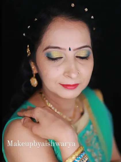 A beautiful dual-tone eye makeup look. I blended shimmery yellow and green eyeshadows for a fresh and festive style, perfect for a Mehendi or Haldi ceremony.