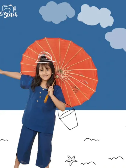 This solid blue co-ord set is a wardrobe staple, ready for any weather. The simple top and pants are made from breathable cotton, ensuring comfort whether it's a sunny day at the beach or a cool, rainy afternoon.